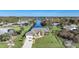 Single-story home situated on a canal with a view of the surrounding neighborhood at 18404 Lake Worth Blvd, Port Charlotte, FL 33948