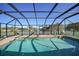 Enjoy this gorgeous screened pool area with canal views at 18404 Lake Worth Blvd, Port Charlotte, FL 33948