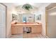 Bathroom featuring double vanity, a large mirror, and shower stall at 18404 Lake Worth Blvd, Port Charlotte, FL 33948