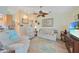 Relaxing living room with comfy seating and a large TV at 18404 Lake Worth Blvd, Port Charlotte, FL 33948