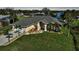 Single-story home exterior with landscaped yard and driveway at 18404 Lake Worth Blvd, Port Charlotte, FL 33948