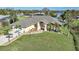 Single-story home with attached garage, landscaping, and a paved driveway at 18404 Lake Worth Blvd, Port Charlotte, FL 33948
