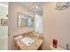 Guest bathroom with vanity, single sink, and large mirror at 18404 Lake Worth Blvd, Port Charlotte, FL 33948