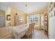 Charming dining room with a table and chairs, adjacent to kitchen at 18404 Lake Worth Blvd, Port Charlotte, FL 33948