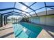 Enjoy this refreshing screened pool with open-air views at 18404 Lake Worth Blvd, Port Charlotte, FL 33948