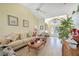 Bright living room features vaulted ceilings and comfortable seating at 18404 Lake Worth Blvd, Port Charlotte, FL 33948