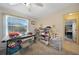 Multipurpose bedroom with desk, shelving, and a comfortable seating area at 18404 Lake Worth Blvd, Port Charlotte, FL 33948