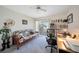Home office space with a futon, desk, and built-in shelving at 18404 Lake Worth Blvd, Port Charlotte, FL 33948