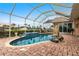 Relaxing kidney-shaped pool with screened enclosure and pool lift at 1215 Via Tripoli, Punta Gorda, FL 33950