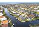 Bird's eye view showcasing home's waterfront location and neighborhood at 1215 Via Tripoli, Punta Gorda, FL 33950