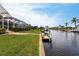 Waterfront property with private dock and lush landscaping at 1215 Via Tripoli, Punta Gorda, FL 33950