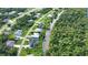 Aerial view of neighborhood with canal and lush vegetation at 1256 Alton Rd, Port Charlotte, FL 33952