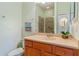 Bathroom featuring a vanity, a framed mirror and a shower with glass doors at 2765 Arugula Dr, North Port, FL 34289