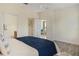 Bright bedroom featuring wood floor, a walk-in closet, and ensuite bathroom at 2765 Arugula Dr, North Port, FL 34289