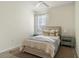 Bright bedroom with a neutral palette, ceiling fan, and a plush area rug at 2765 Arugula Dr, North Port, FL 34289