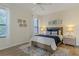 Inviting bedroom with neutral walls, wood-look floors, and natural light from two windows at 2765 Arugula Dr, North Port, FL 34289