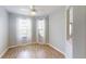 Bonus room bathed in natural light, featuring smooth wood floors and neutral paint, perfect for flexible use at 2765 Arugula Dr, North Port, FL 34289
