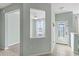 Entryway with tile flooring and a transom window to the adjacent bedroom at 2765 Arugula Dr, North Port, FL 34289