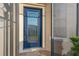 Front door with decorative glass accents, offering natural light and curb appeal at 2765 Arugula Dr, North Port, FL 34289
