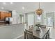 Well-equipped kitchen with stainless steel appliances, warm wood cabinets, and stylish granite countertops at 2765 Arugula Dr, North Port, FL 34289