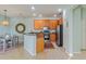 Open kitchen and dining area featuring stainless steel appliances, and a modern chandelier at 2765 Arugula Dr, North Port, FL 34289