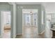 Bright living room features wood floors, lots of natural light, and fresh paint at 2765 Arugula Dr, North Port, FL 34289