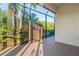 Enclosed patio with tropical landscaping view through the screened windows at 2765 Arugula Dr, North Port, FL 34289