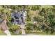 Aerial view showcasing house, pool, garden, and surrounding landscape at 3164 Broad Ave, North Port, FL 34286