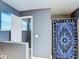 Charming bathroom with walk-in shower, designer shower curtain, and large window at 3316 Kacher Rd, North Port, FL 34288