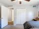 View of bedroom with ceiling fan, closet and view to hallway at 3316 Kacher Rd, North Port, FL 34288