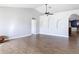 Large living room with an open layout, hardwood floors, and decorative recessed wall panels at 3316 Kacher Rd, North Port, FL 34288