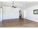 Spacious living room featuring neutral walls and hardwood floors, accentuated by recessed wall decor at 3316 Kacher Rd, North Port, FL 34288