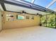 Spacious outdoor screened-in patio with ceiling fans, offering a comfortable and relaxing entertainment area at 3316 Kacher Rd, North Port, FL 34288