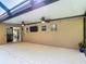 Enjoy the large covered back patio with ceiling fans and tv at 3316 Kacher Rd, North Port, FL 34288