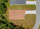 Overhead view of the house showcasing the layout of the roof, lawn, and surroundings at 3390 Nadasky Ave, North Port, FL 34288