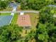 Aerial view of home showcasing the roof, surrounding greenery, and proximity to the neighborhood at 3390 Nadasky Ave, North Port, FL 34288