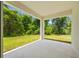 Spacious back porch overlooking a lush green backyard, perfect for outdoor relaxation at 3390 Nadasky Ave, North Port, FL 34288