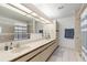 Bathroom with double vanity, shower, and updated fixtures at 3636 Aruba Ct, Punta Gorda, FL 33950