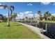 Private dock with boat lift and lush landscaping; prime waterfront property at 3636 Aruba Ct, Punta Gorda, FL 33950
