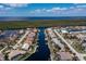 Bird's-eye view of home, pool, and desirable waterfront location at 3636 Aruba Ct, Punta Gorda, FL 33950