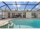 Pool area with covered patio and access to the house at 3636 Aruba Ct, Punta Gorda, FL 33950
