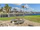 Charming backyard with a waterfront view and seating area at 3636 Aruba Ct, Punta Gorda, FL 33950