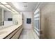 Clean bathroom with double vanity, shower, and bathtub at 3636 Aruba Ct, Punta Gorda, FL 33950