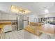 Eat-in kitchen with stainless steel appliances and a large island at 3636 Aruba Ct, Punta Gorda, FL 33950