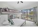 Bedroom with a bunk bed and sliding glass doors leading to patio at 3636 Aruba Ct, Punta Gorda, FL 33950