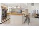 Kitchen with light cabinetry, breakfast bar, and views into the dining area at 3636 Aruba Ct, Punta Gorda, FL 33950