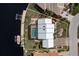 Property overview; showing house, pool, and canal access from above at 3636 Aruba Ct, Punta Gorda, FL 33950