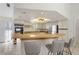 Bright kitchen features a breakfast bar, stainless steel appliances, and ample counter space at 3636 Aruba Ct, Punta Gorda, FL 33950