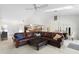 Spacious living room boasts a large sectional sofa and access to the kitchen at 3636 Aruba Ct, Punta Gorda, FL 33950