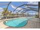 Inviting screened-in pool area with ample space for relaxation and entertainment at 3636 Aruba Ct, Punta Gorda, FL 33950